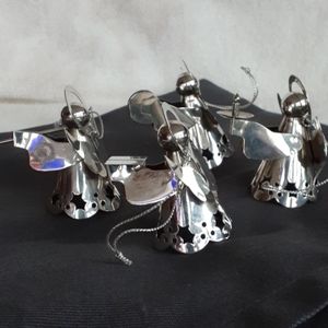 4 metal angel ornaments made in China.